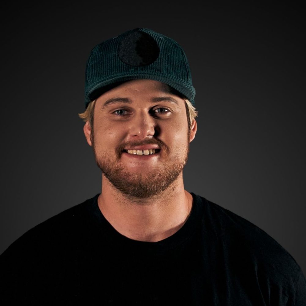 Headshot of Rob Joseph smiling against a dark background.